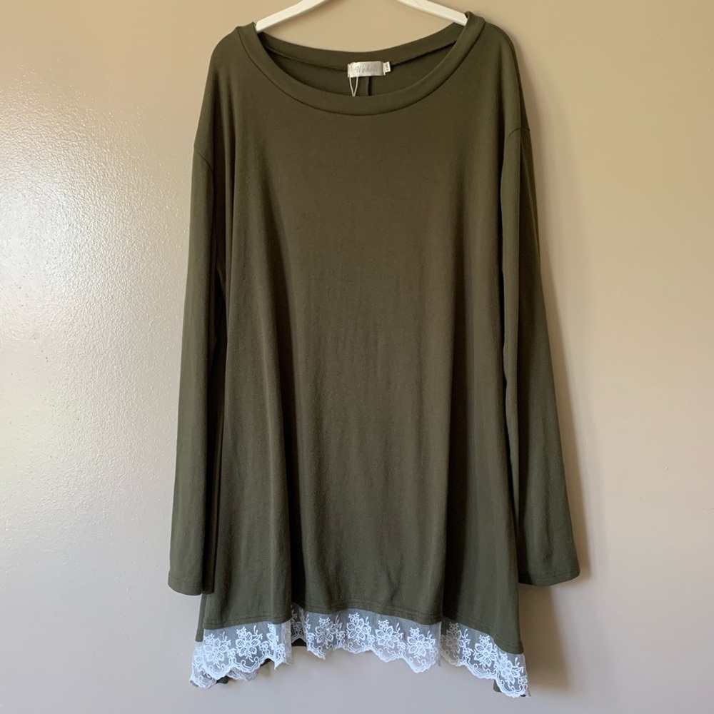 Long sleeved green top.